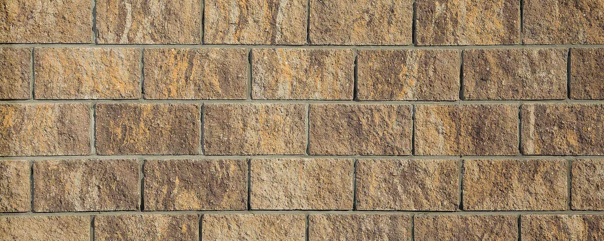 Блоки вибропрессованные стеновые колотый камень